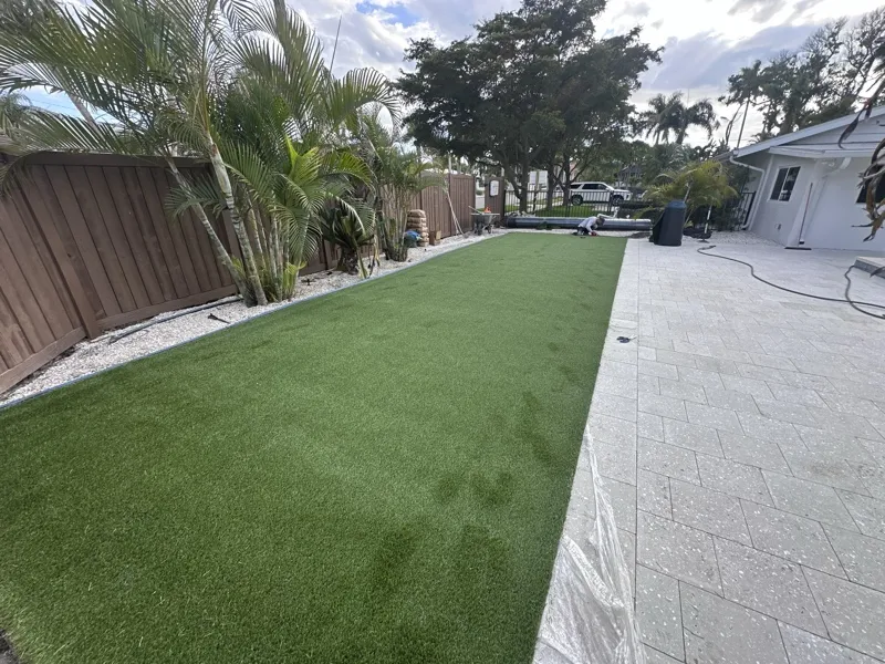 Artificial turf and paver hardscape by Master360 Services in St. Petersburg, FL